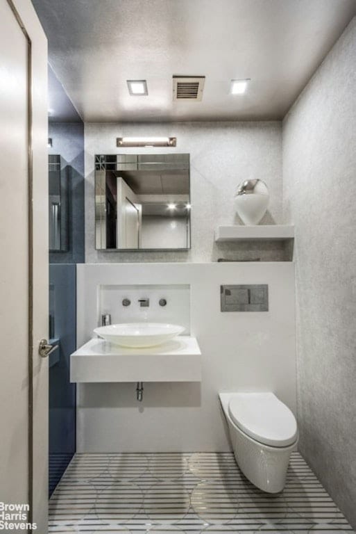 bathroom with toilet and sink