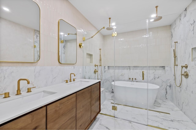 134 Weirfield St Unit 2, New York City, NY 11221 - full bath featuring tile walls, marble tiled flooring, a marble finish shower, a freestanding tub, and double vanity