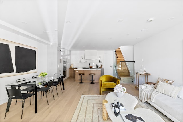 134 Weirfield St Unit 2, New York City, NY 11221 - living area with light wood-style flooring and stairs