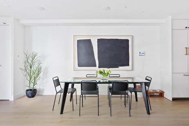 dining space with light wood-type flooring, baseboards, and recessed lighting