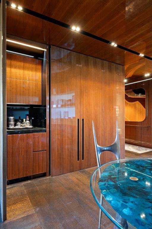 kitchen featuring wooden ceiling and wood walls