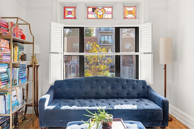 interior space featuring baseboards and wood finished floors