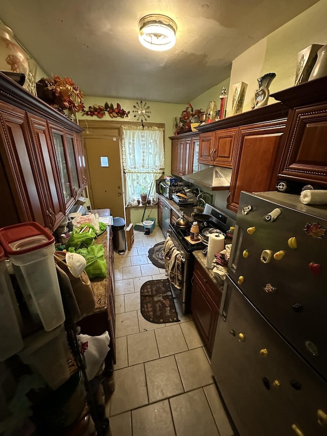 229 Nichols Ave, New York City, NY 11208 - laundry room with light tile patterned flooring