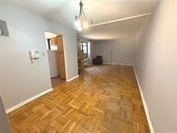 hallway featuring baseboards