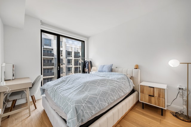 bedroom featuring wood-type flooring