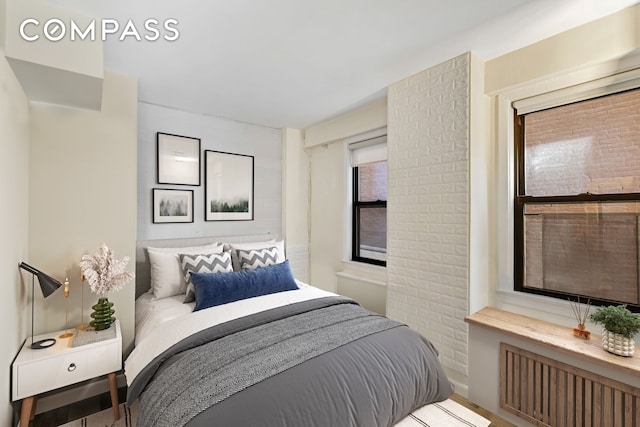 245 E 24th St Unit 2L, New York City, NY 10010 - bedroom featuring radiator