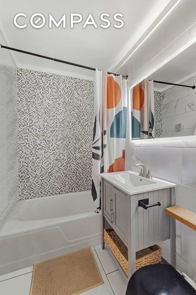 full bath featuring decorative backsplash, vanity, tile walls, and shower / tub combo with curtain