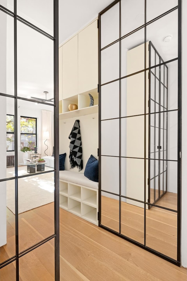 mudroom with wood finished floors