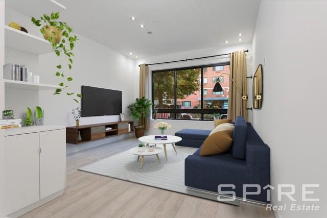 living room with light hardwood / wood-style flooring