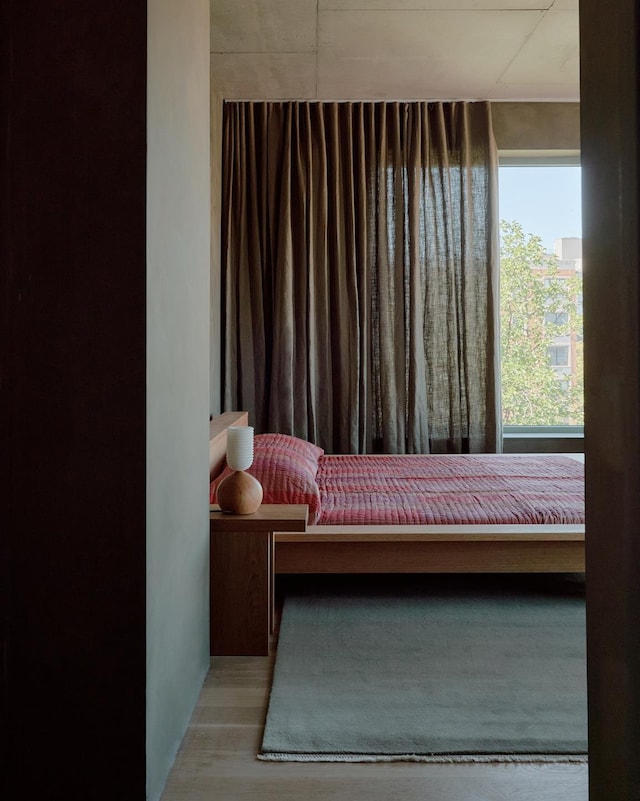 bedroom with wood finished floors