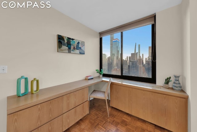 office featuring built in desk and dark parquet floors