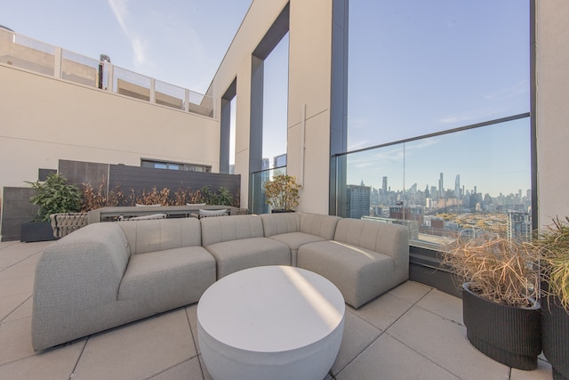 view of patio / terrace with a view of city and outdoor lounge area