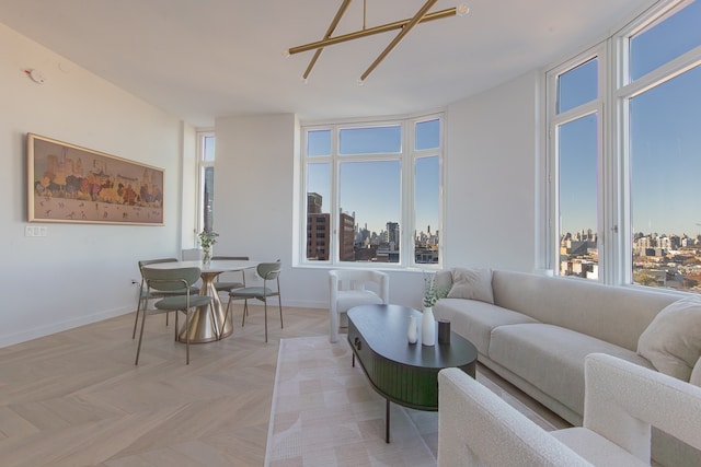 living room featuring a view of city and baseboards