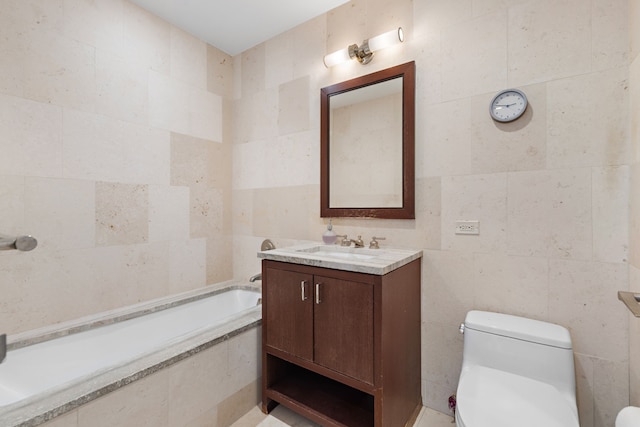 full bath featuring tile walls, tiled tub, toilet, and vanity