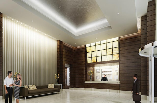 community lobby with a towering ceiling and recessed lighting