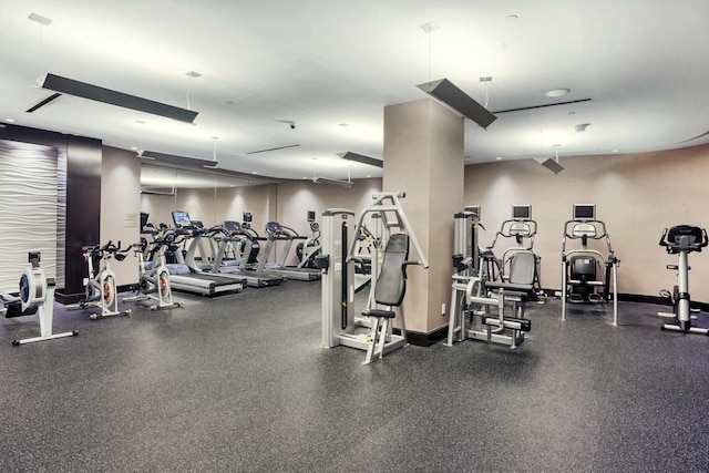 workout area featuring baseboards