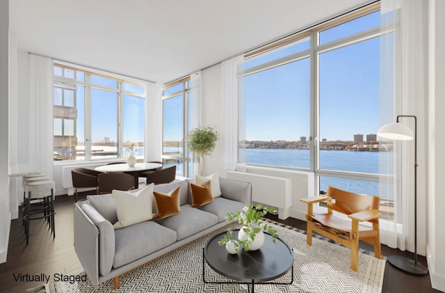 sunroom / solarium with a water view