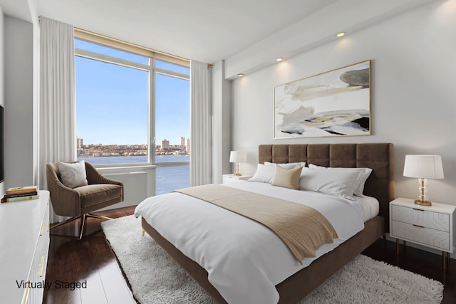 100 Riverside Blvd Unit 14N, New York City, NY 10069 - bedroom with wood finished floors, a water view, a view of city, and recessed lighting