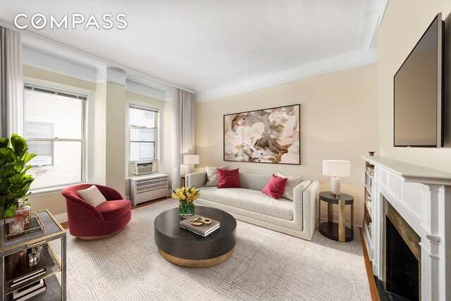 living room featuring a wealth of natural light and ornamental molding