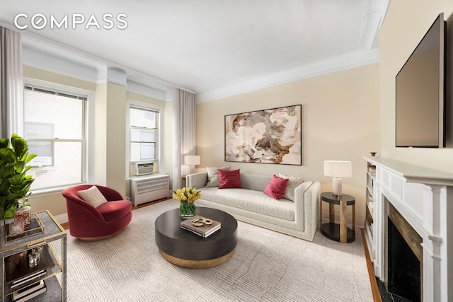 living room featuring carpet floors, ornamental molding, a fireplace, and baseboards