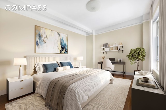 bedroom featuring baseboards and wood finished floors