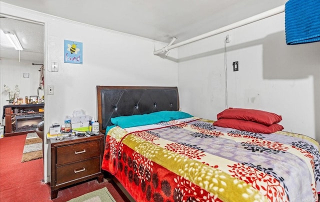 bedroom featuring dark carpet