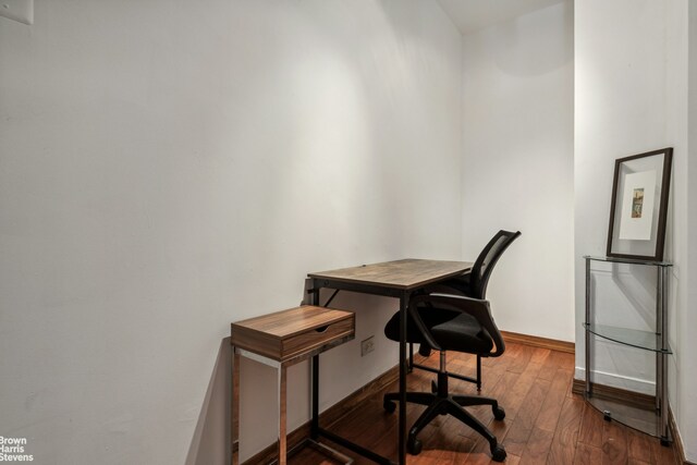 office area featuring baseboards and hardwood / wood-style floors