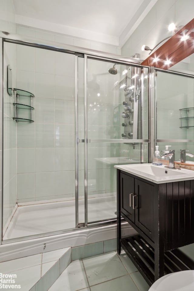 bathroom featuring a stall shower and vanity