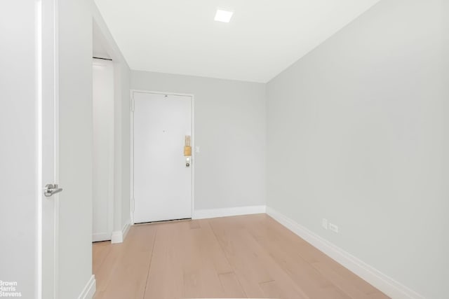 unfurnished room with light hardwood / wood-style floors