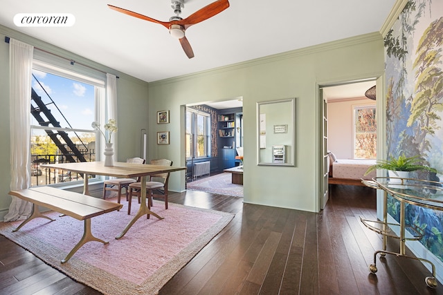 dining area featuring visible vents, ornamental molding, a ceiling fan, and dark wood-style flooring