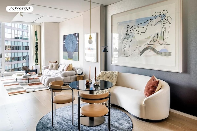 100 E 53rd St Unit 31B, New York City, NY 10022 - sitting room with expansive windows and wood-type flooring