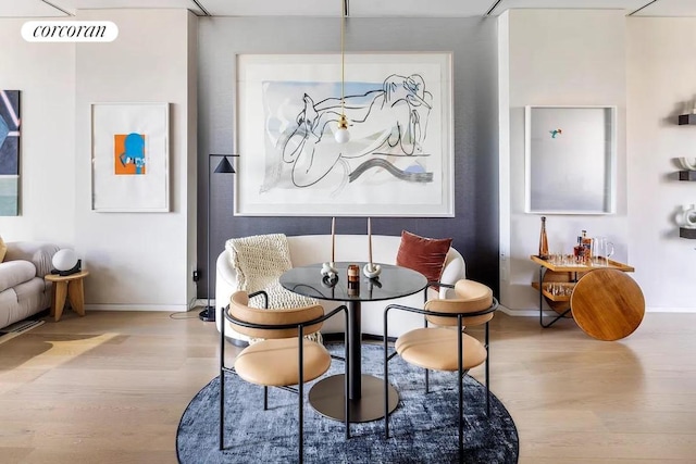 dining area featuring light wood-type flooring