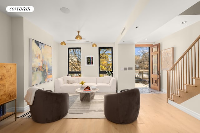 living room with light hardwood / wood-style floors