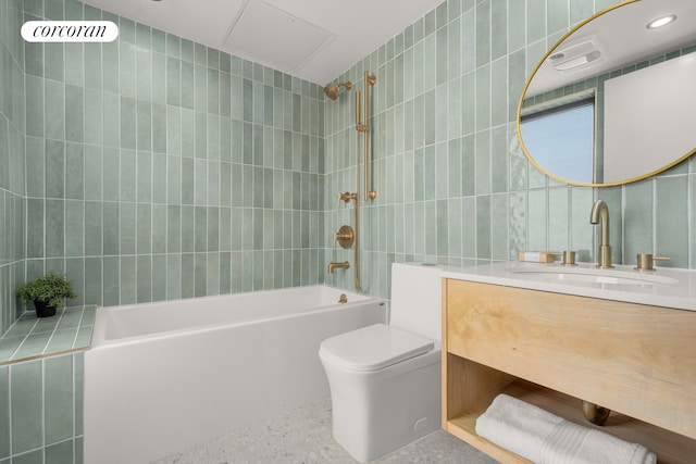 full bathroom featuring  shower combination, tile walls, toilet, and vanity