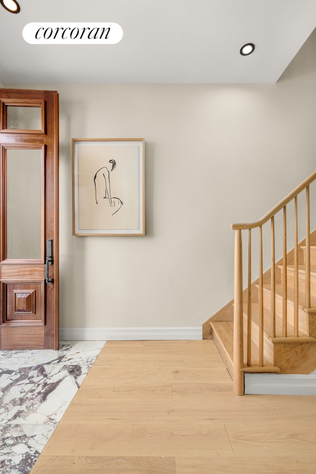 interior space featuring stairway, recessed lighting, wood finished floors, and baseboards