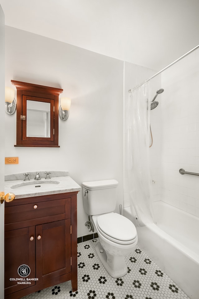 full bath featuring toilet, tile patterned floors, vanity, and shower / tub combo with curtain