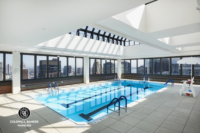 indoor pool featuring a skyline view