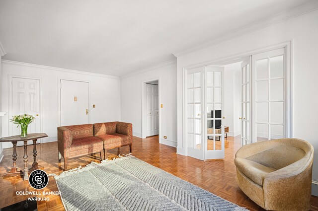 living room with parquet flooring, ornamental molding, and french doors