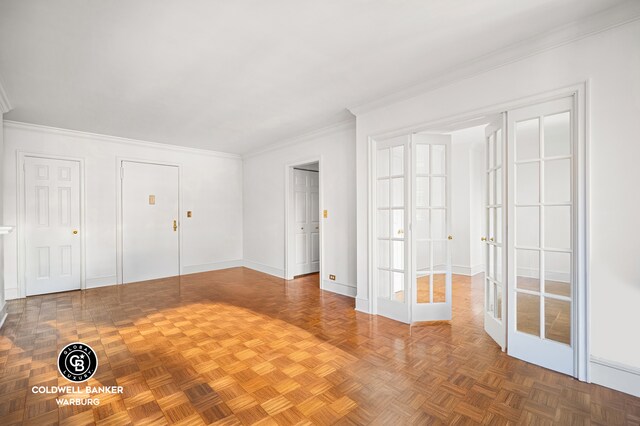 corridor featuring radiator heating unit, baseboards, and crown molding