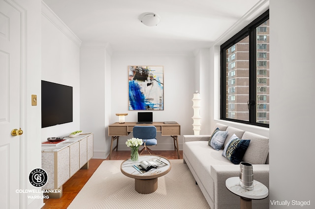 living room with crown molding, an office area, and baseboards