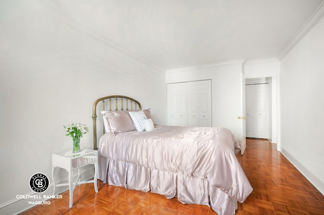 bedroom featuring ornamental molding, a closet, and baseboards