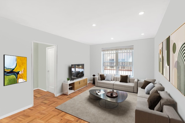 living room with baseboards and recessed lighting