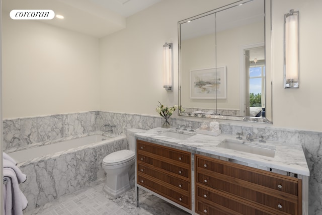 full bathroom featuring a bath, double vanity, a sink, and wainscoting