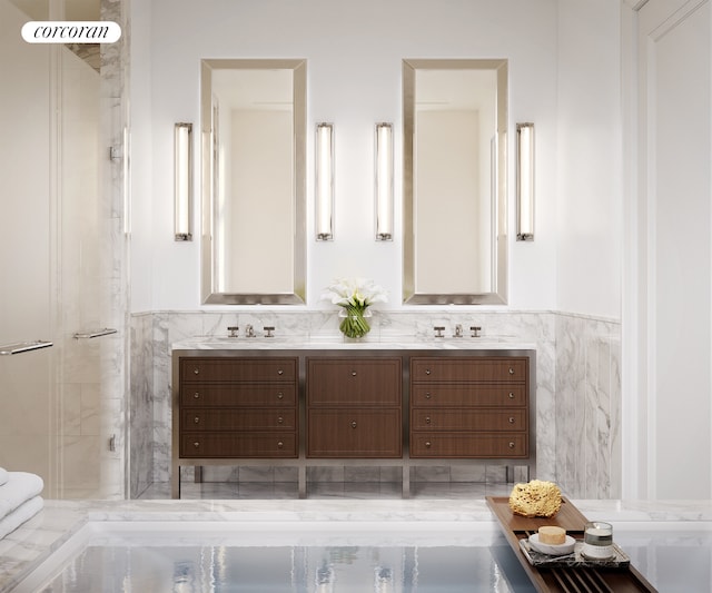 100 Claremont Ave Unit 35C, New York City, NY 10027 - bathroom featuring double vanity, a shower stall, tile walls, and a wainscoted wall