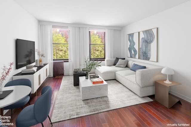 living room with baseboards, dark wood-type flooring, and radiator