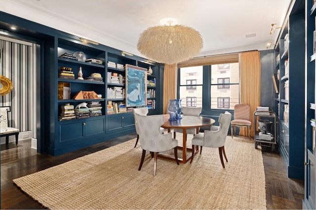 dining area featuring crown molding and dark hardwood / wood-style flooring