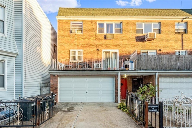 view of front of house with a balcony and a garage