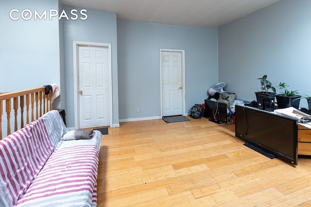 office area with light wood finished floors and baseboards