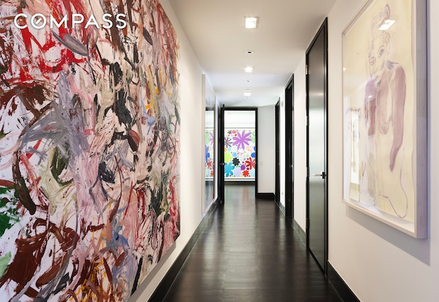 151 E 85th St Unit 14A, New York City, NY 10028 - hall featuring dark wood-style floors and baseboards