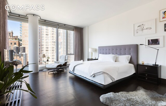 151 E 85th St Unit 14A, New York City, NY 10028 - bedroom featuring wood finished floors and floor to ceiling windows